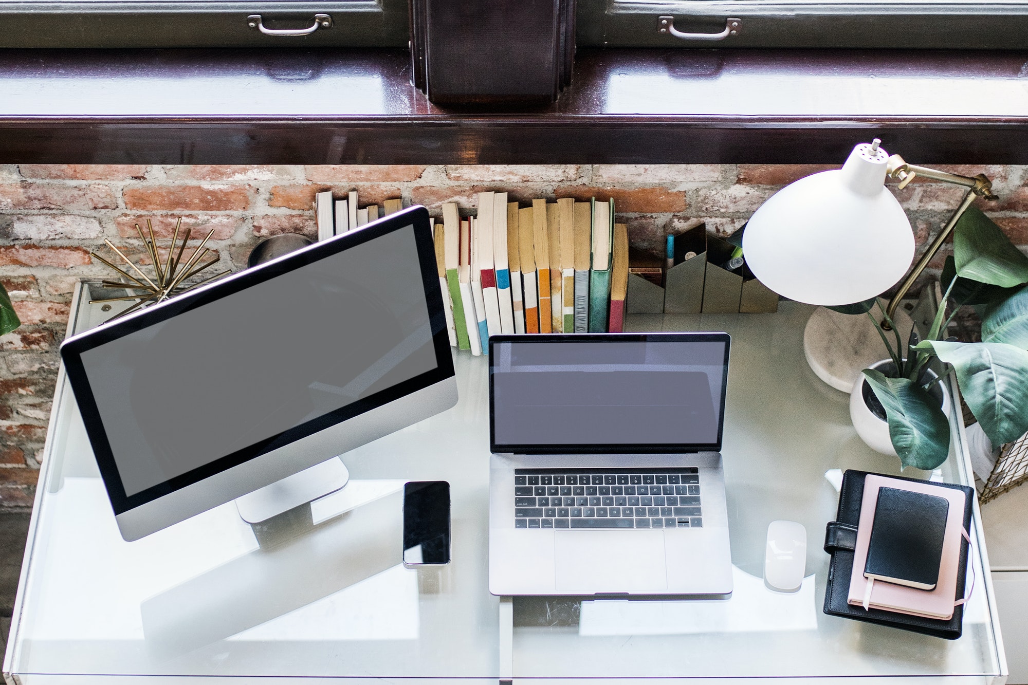 PC monitor, laptop, and smartphone on a desk